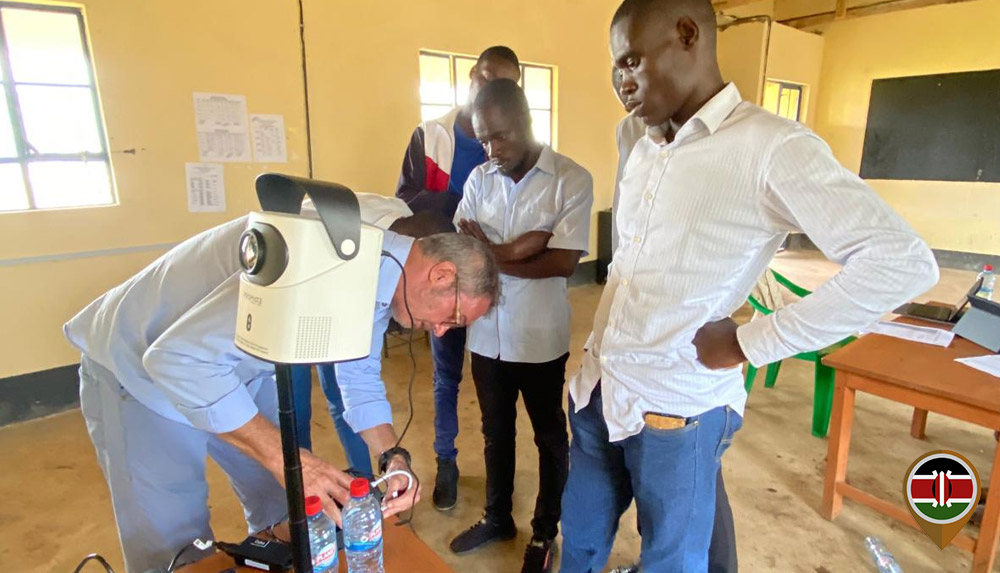 Dr Peter Kaune connects devices to the projector